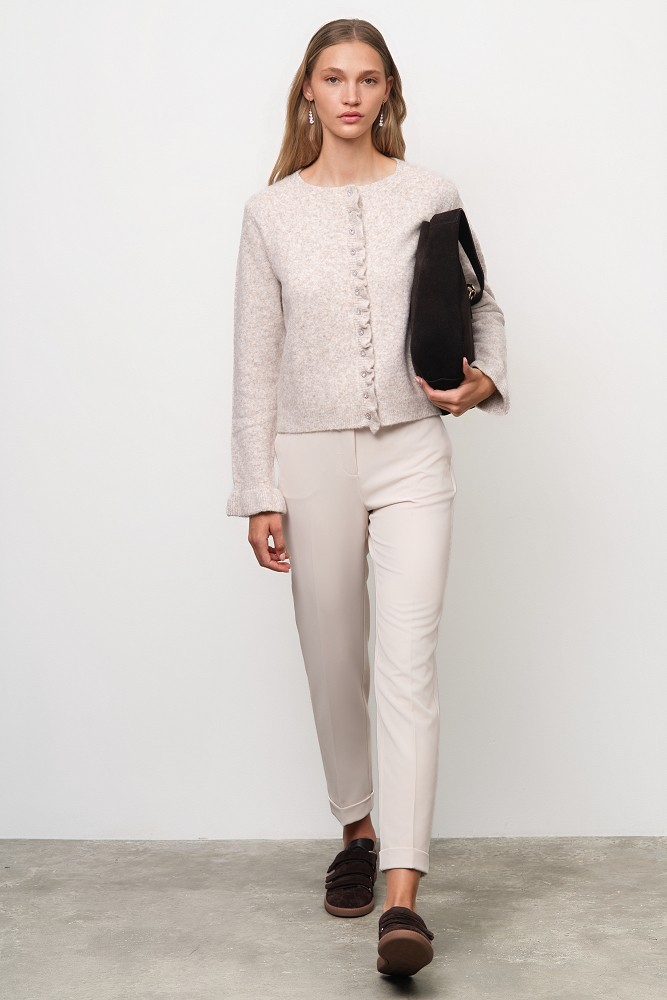 Knitted cardigan with jewel buttons and ruffles