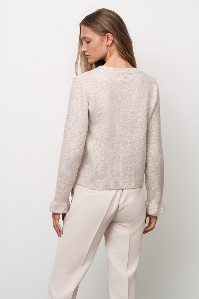 Knitted cardigan with jewel buttons and ruffles