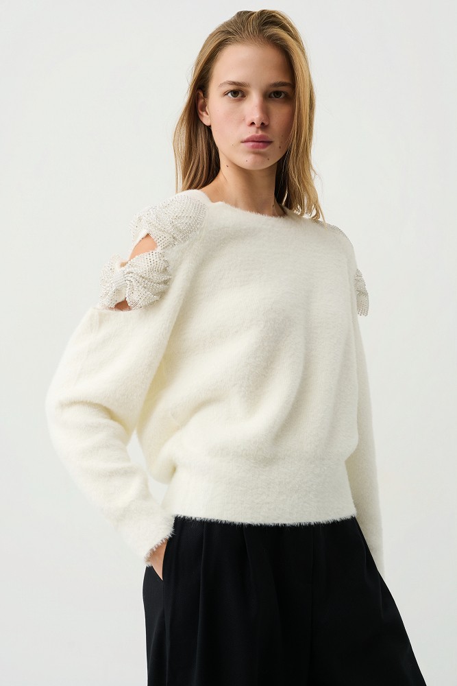 Sweater with bow and rhinestone embellished sleeves