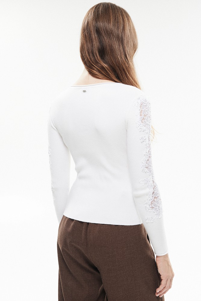 Knitted blouse with rhinestones and lace sleeves