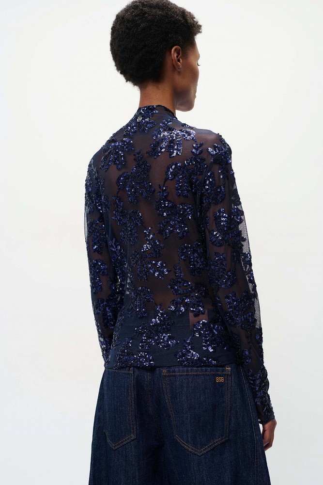 Sheer top with sequin embellishments