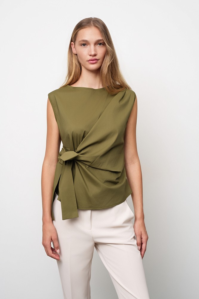Sleeveless top with a decorative bow