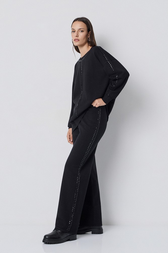 Pantalones de punto con botones a presión laterales