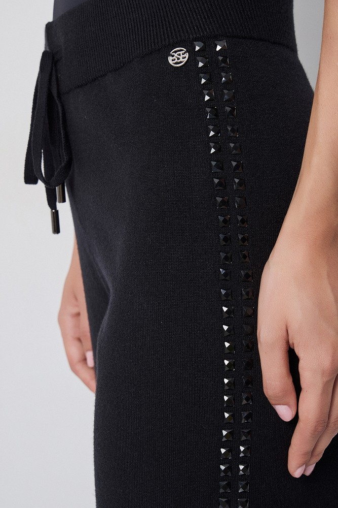 Pantalones de punto con botones a presión laterales