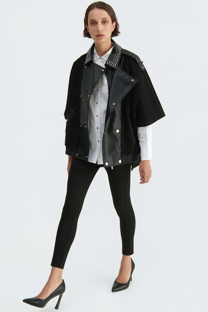 Cape with a combination of leather-look and wool fabric
