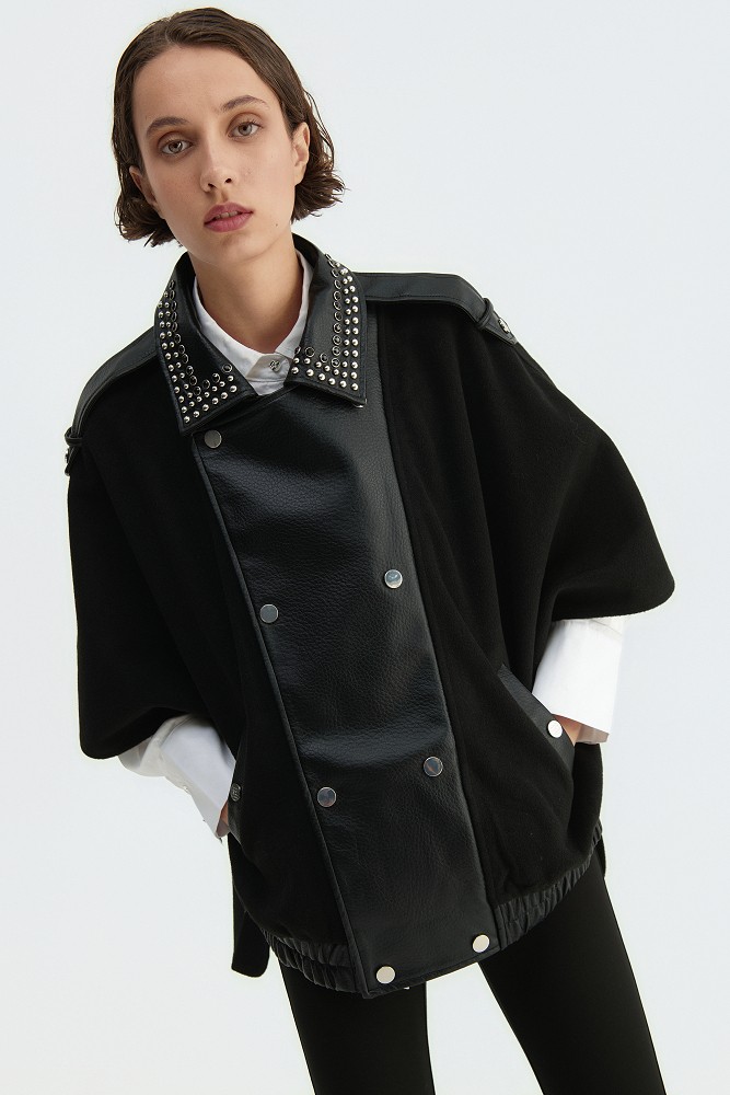 Cape with a combination of leather-look and wool fabric