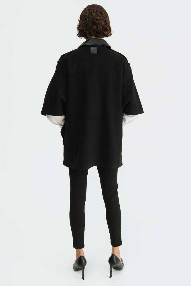 Cape with a combination of leather-look and wool fabric