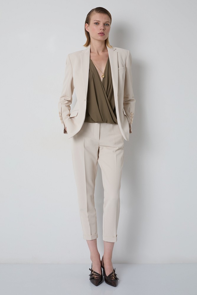 Sleeveless wrap blouse with a necklace detail