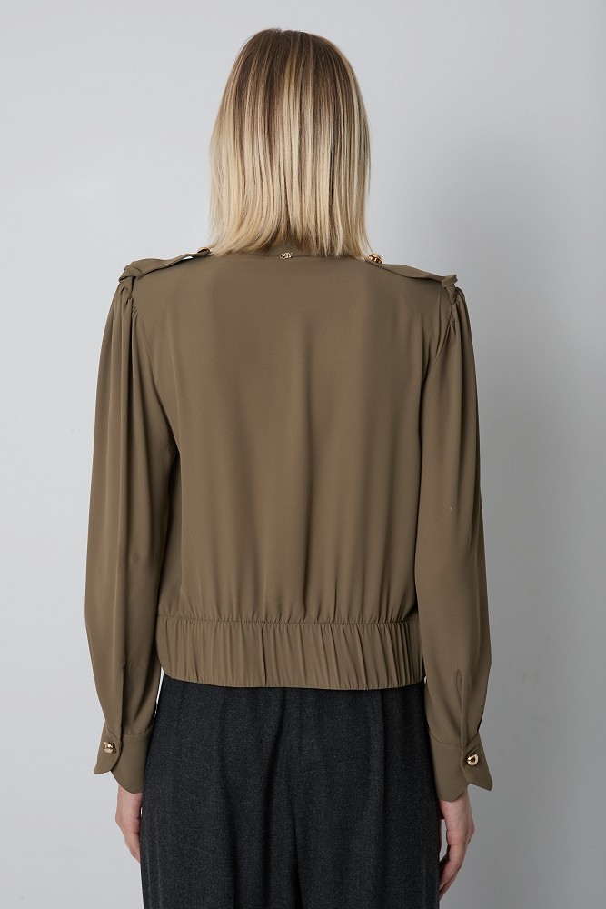 Blouse with decorative buttons