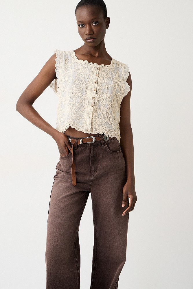 Sleeveless embroidered top with buttons