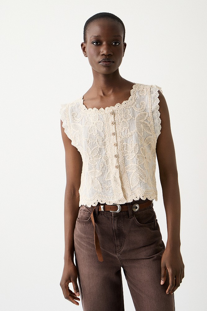 Sleeveless embroidered top with buttons