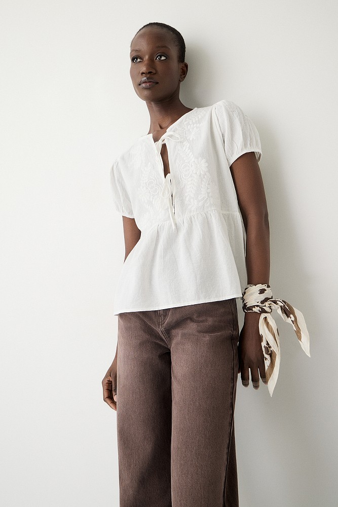 Embroidered blouse with short sleeves and self tie