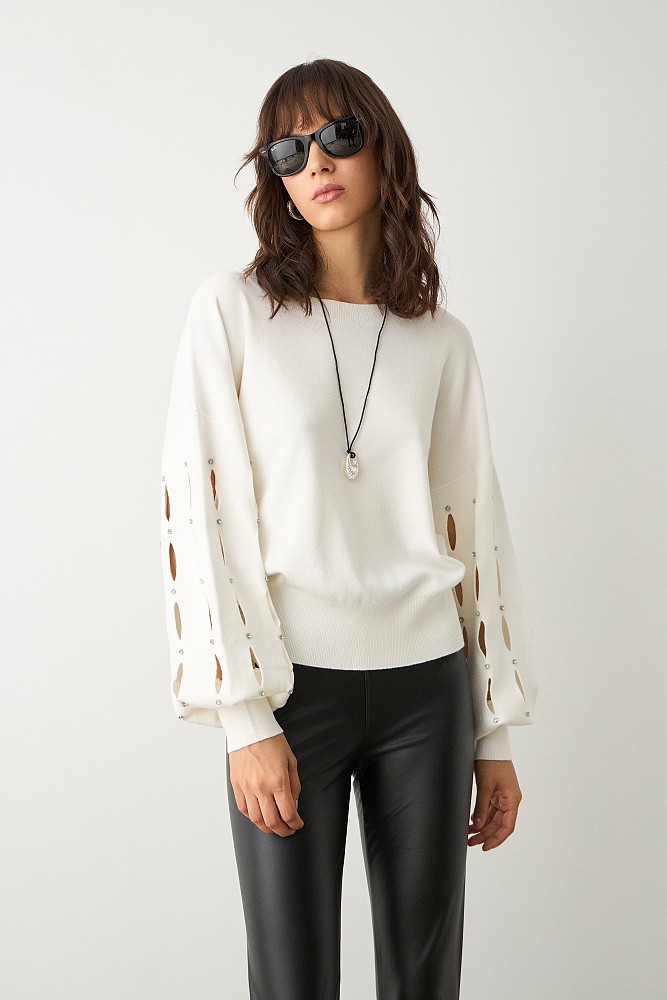 Sweater with cut outs on the sleeves