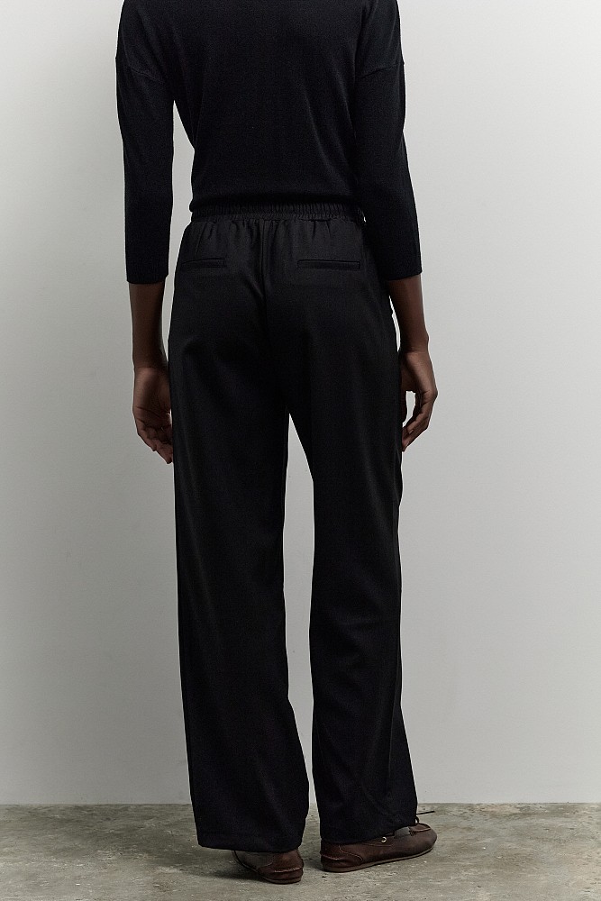 Pants with self-tie strap