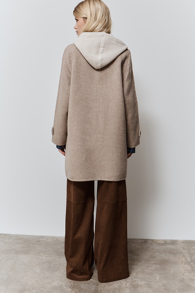 Coat with knitted hood