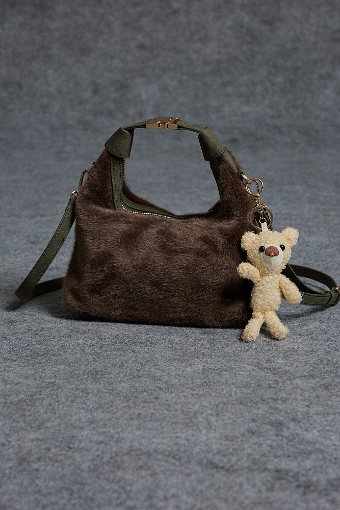Furry bag with hanging accessory