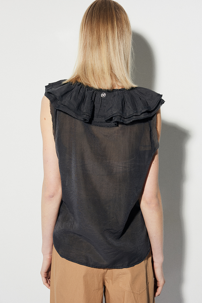 Sleeveless blouse with ruffles