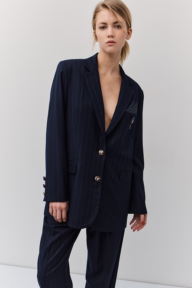 Striped blazer with bejeweled pin