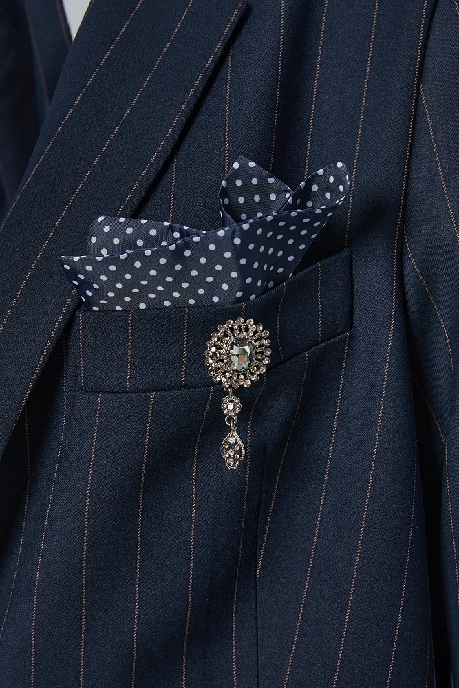 Striped blazer with bejeweled pin