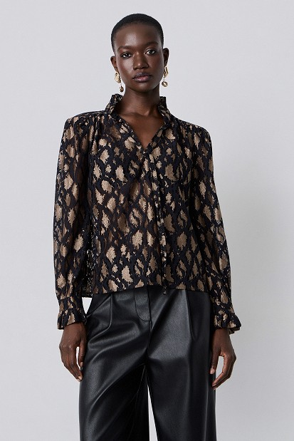 Animal-print blouse with lace and shoulder pads
