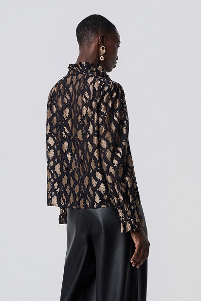 Animal-print blouse with lace and shoulder pads