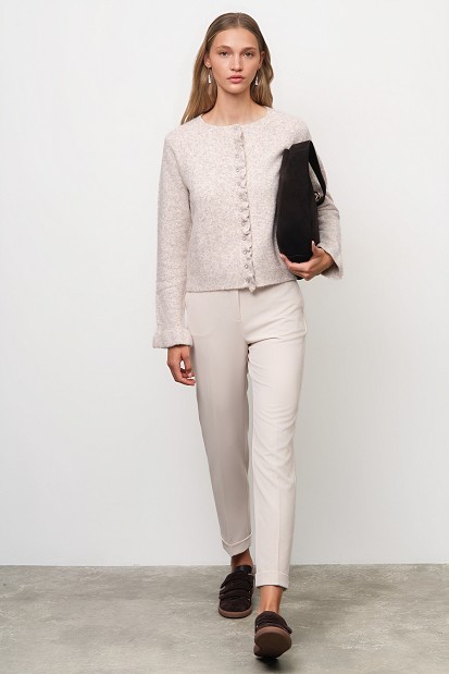Knitted cardigan with jewel buttons and ruffles