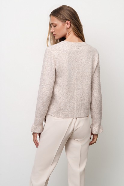 Knitted cardigan with jewel buttons and ruffles