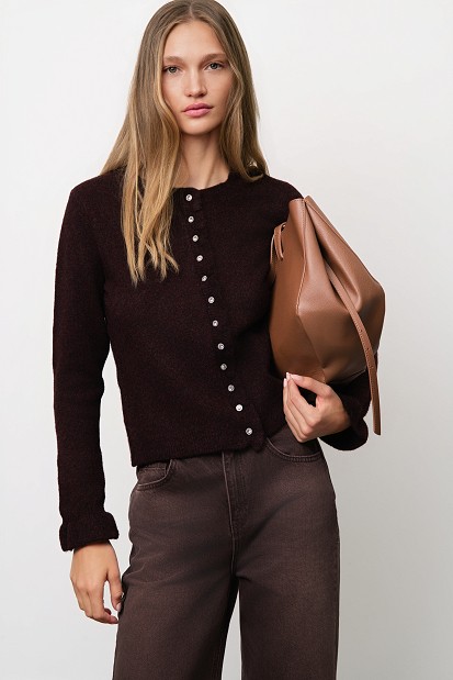 Knitted cardigan with jewel buttons and ruffles