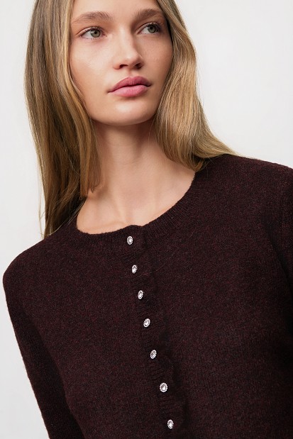 Knitted cardigan with jewel buttons and ruffles