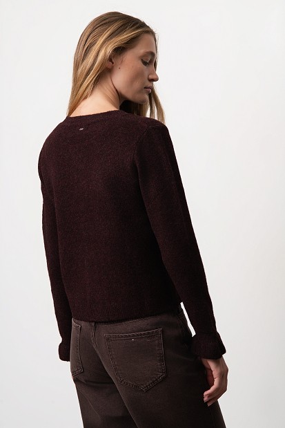 Knitted cardigan with jewel buttons and ruffles