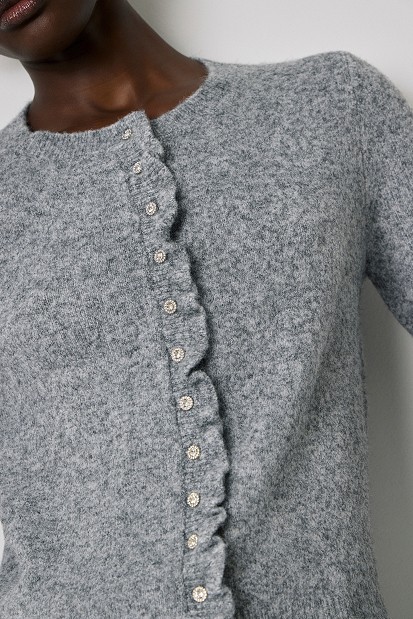 Knitted cardigan with jewel buttons and ruffles