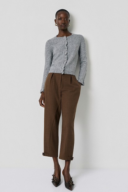 Knitted cardigan with jewel buttons and ruffles
