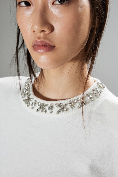 Embellished knit sweater with decorative stones