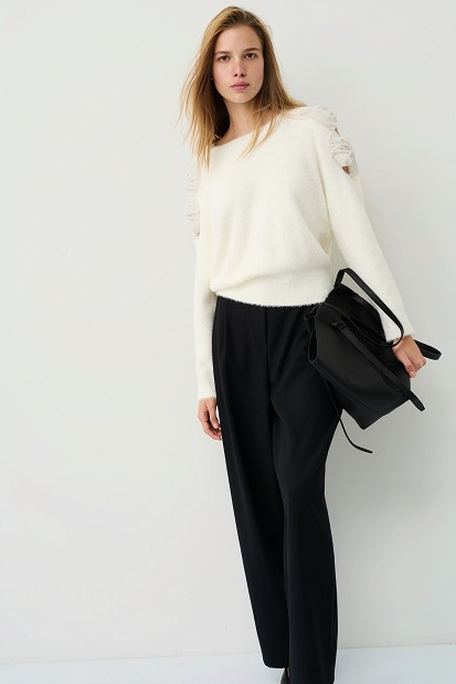 Sweater with bow and rhinestone embellished sleeves