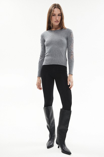 Knitted blouse with rhinestones and lace sleeves