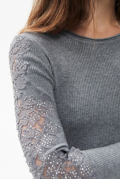 Knitted blouse with rhinestones and lace sleeves