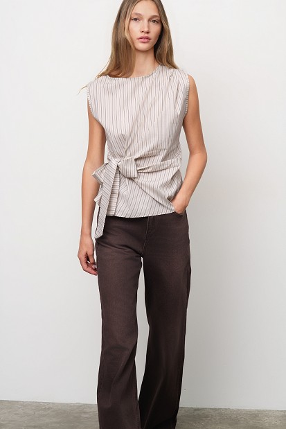 Sleeveless striped top with a decorative bow