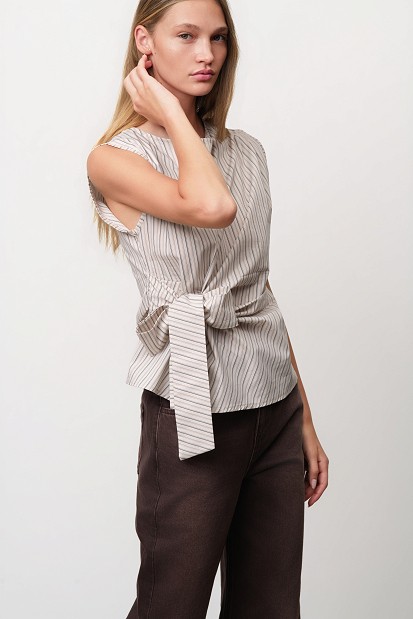 Sleeveless striped top with a decorative bow