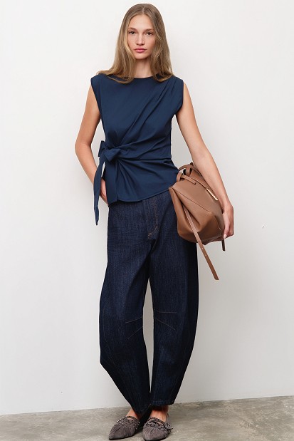 Sleeveless top with a decorative bow