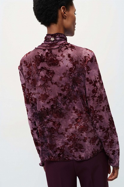 Sheer top with raised floral details