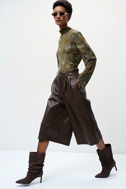 Sheer top with raised floral details
