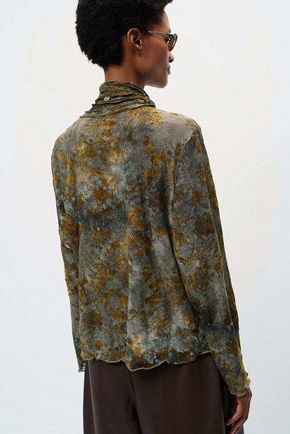 Sheer top with raised floral details