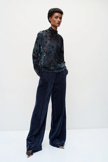 Sheer top with raised floral details