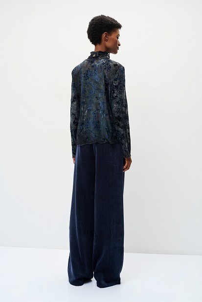 Sheer top with raised floral details