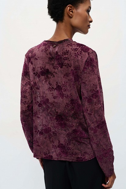 Sheer top with raised floral details