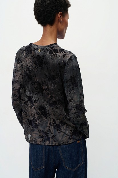 Sheer top with raised floral details