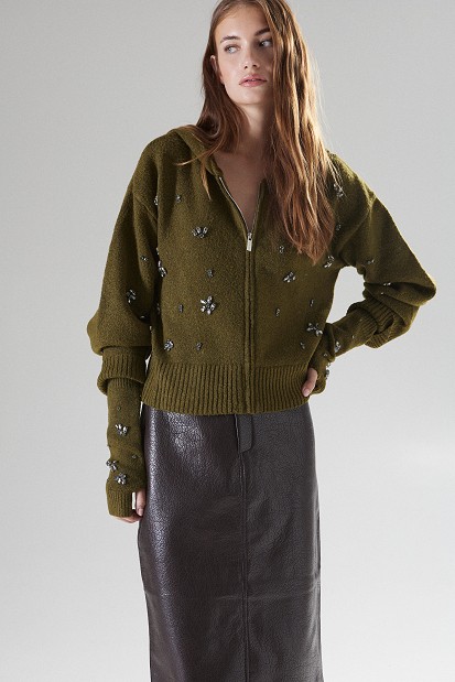 Knitted cardigan with decorative embellishments