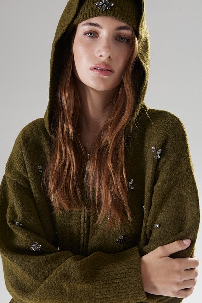 Knitted cardigan with decorative embellishments