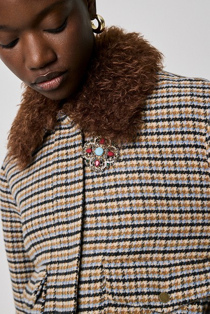 Checked jacket with a faux fur collar