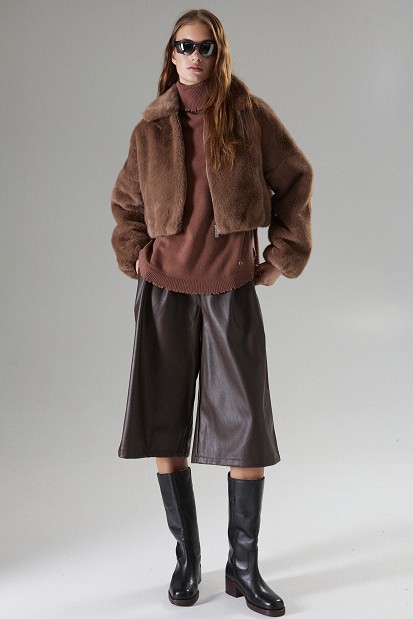 Cropped bomber jacket with decorative pins on the collar